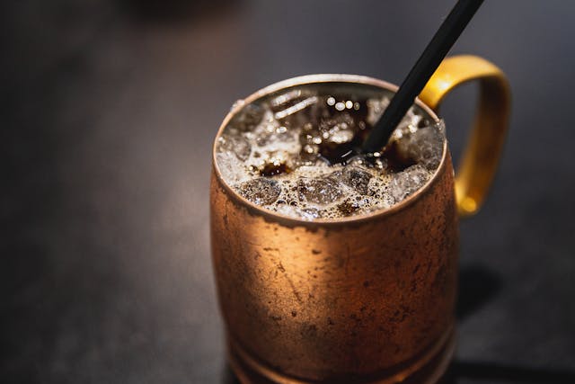 plain iced coffee in a copper colored cup